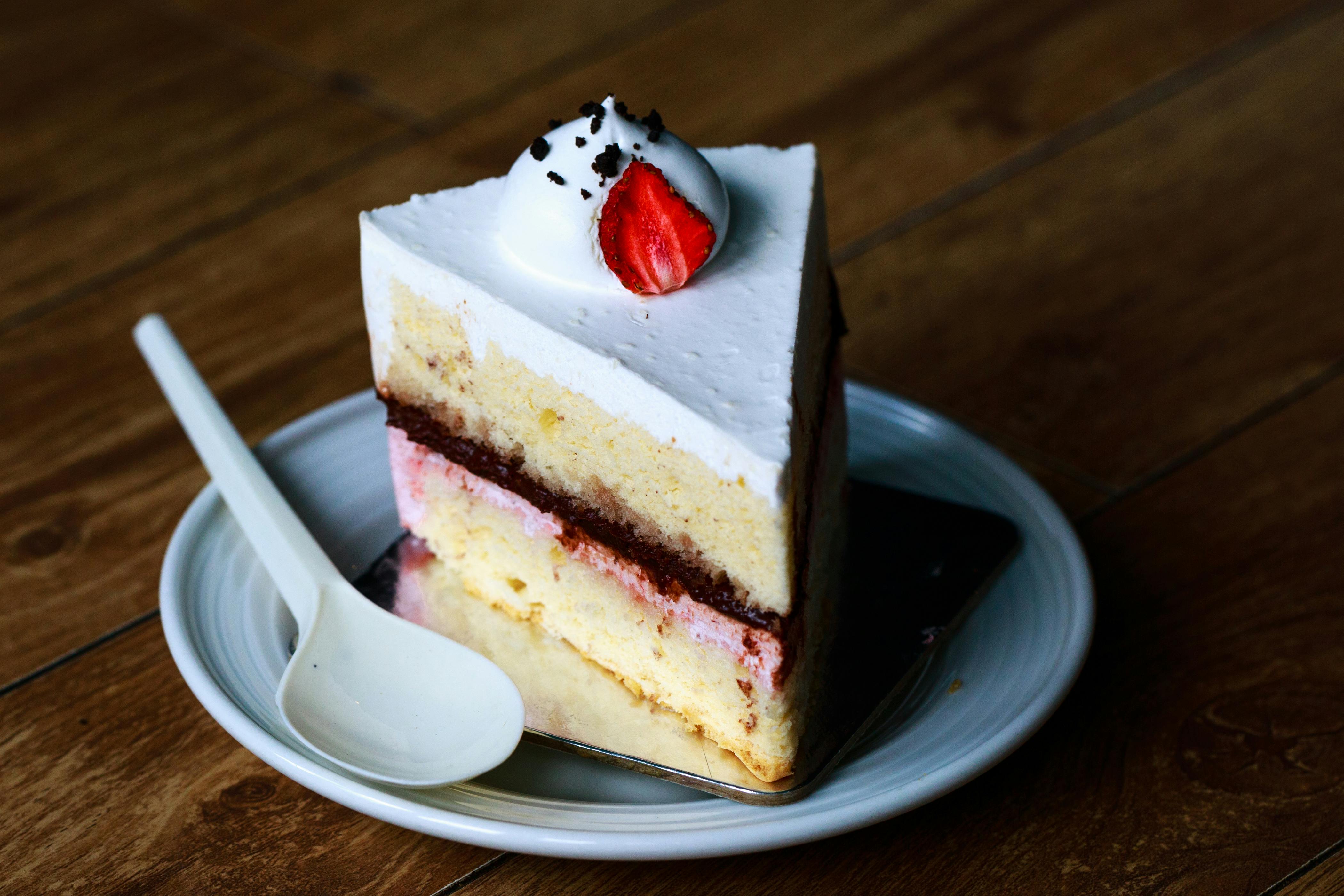A slice of cake with a strawberry on top